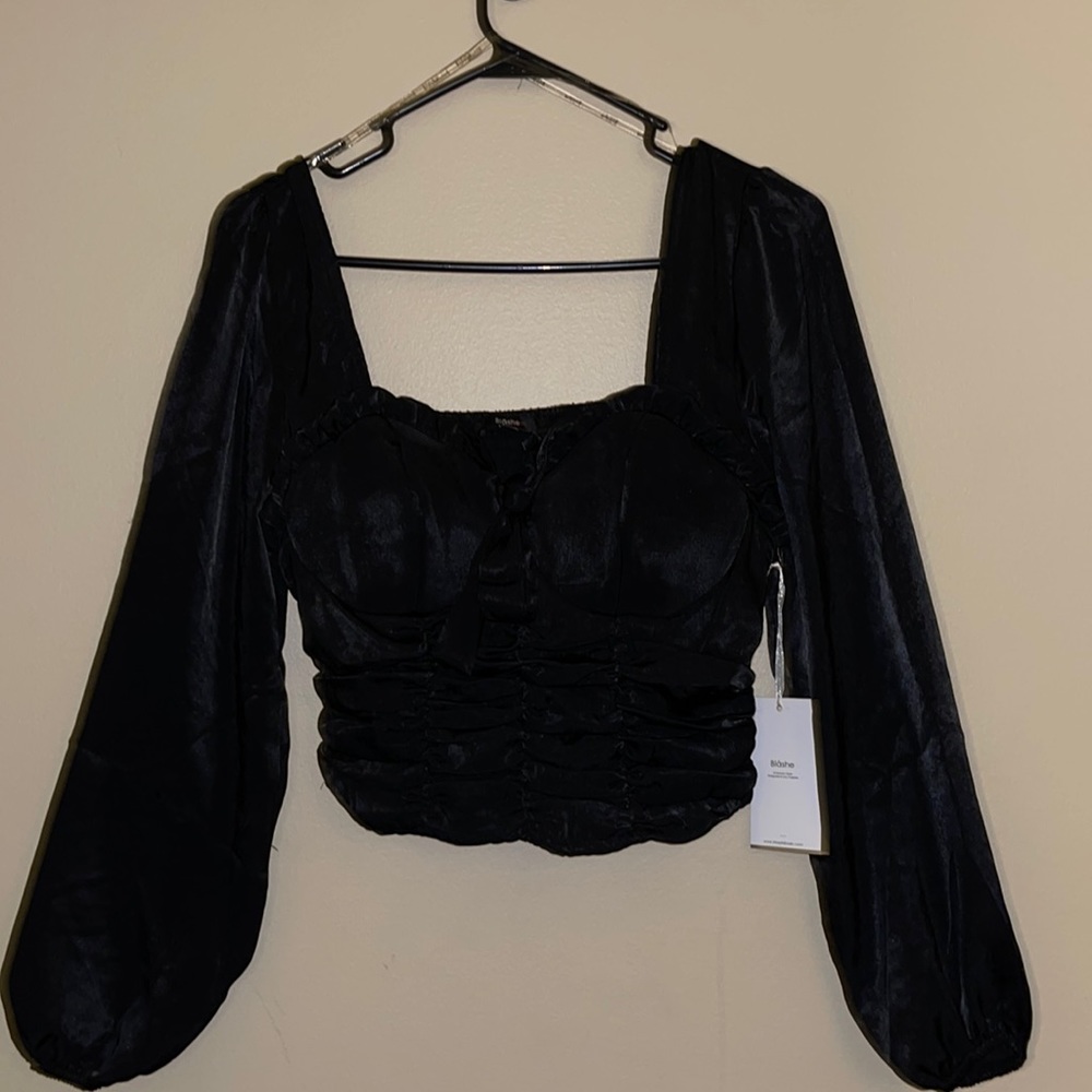 Small black going out top. Never worn.